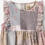 Wheat Main Sommerdragt Emmaline Romper 9618 patchwork flowers