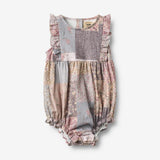 Wheat Main Sommerdragt Emmaline Romper 9618 patchwork flowers